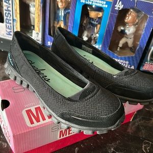 Sketchers black slip on 9